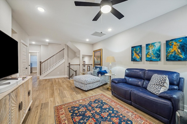 living room with ceiling fan and wood-type flooring