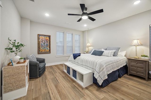 bedroom featuring ceiling fan and light hardwood / wood-style floors