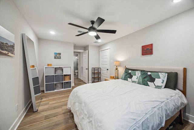 bedroom with hardwood / wood-style floors and ceiling fan