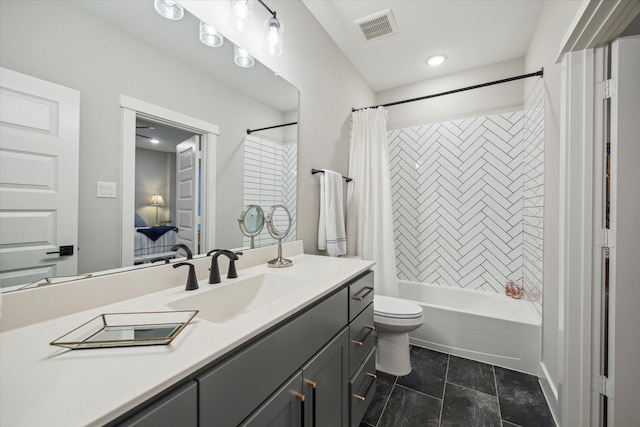 full bathroom with toilet, shower / bath combo, and vanity