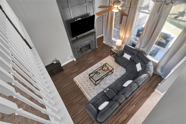 living room with ceiling fan and wood-type flooring