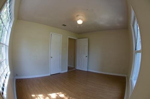 unfurnished bedroom featuring hardwood / wood-style floors