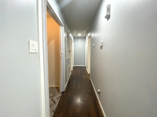 corridor with dark wood-type flooring