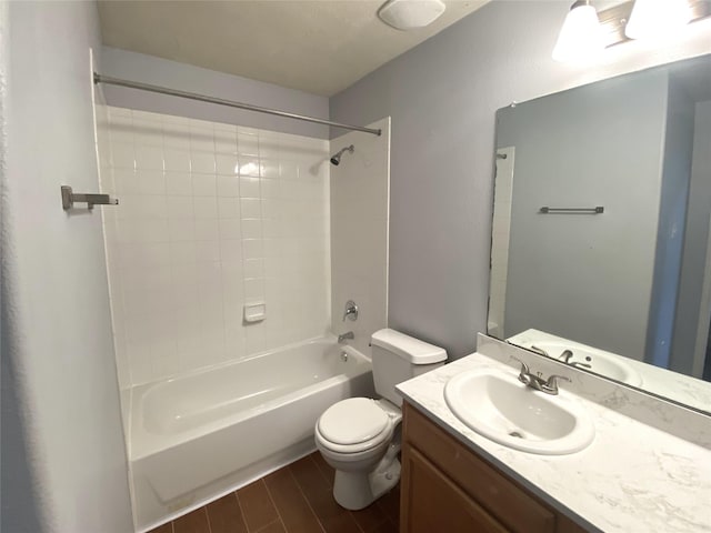 full bathroom with vanity, toilet, and tiled shower / bath