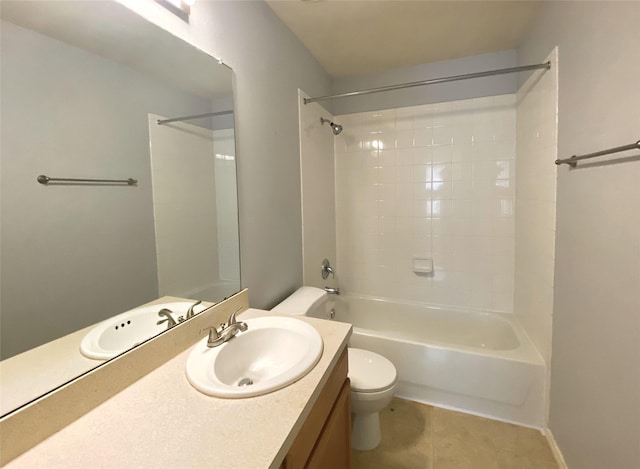 full bathroom featuring tile patterned floors, toilet, tiled shower / bath combo, and vanity