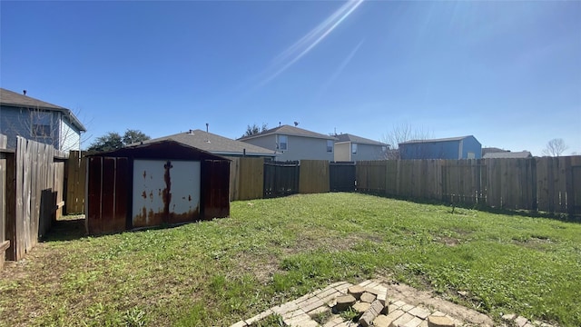 view of yard with a patio and a storage unit