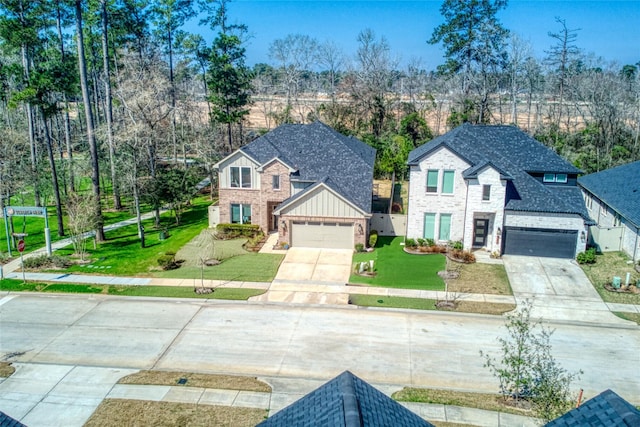 view of front of home with a garage and a front yard