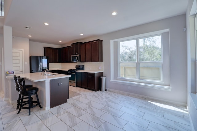 15158 N Heron Heights Way, Magnolia, TX 77354 - kitchen with light countertops, recessed lighting, appliances with stainless steel finishes, and a sink