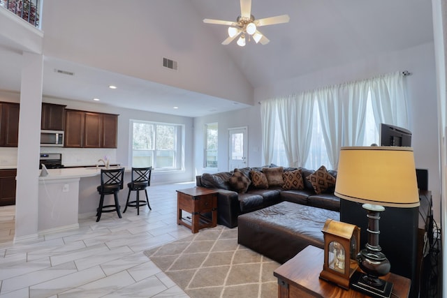 15158 N Heron Heights Way, Magnolia, TX 77354 - living area with visible vents, a ceiling fan, recessed lighting, and high vaulted ceiling