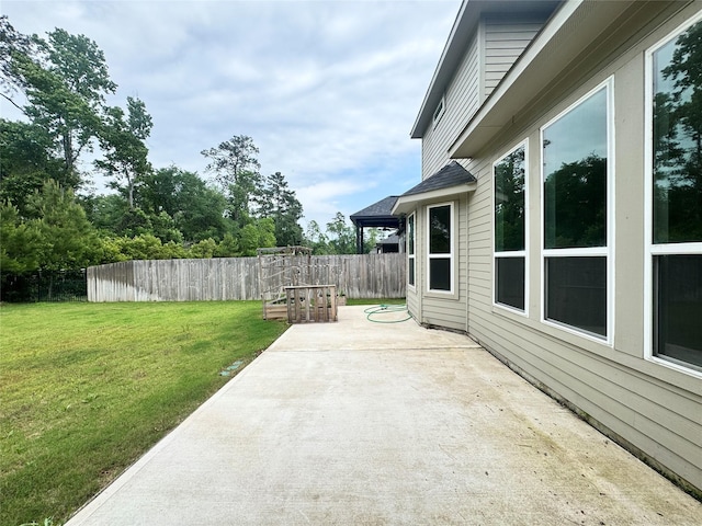15158 N Heron Heights Way, Magnolia, TX 77354 - view of patio with a garden and fence