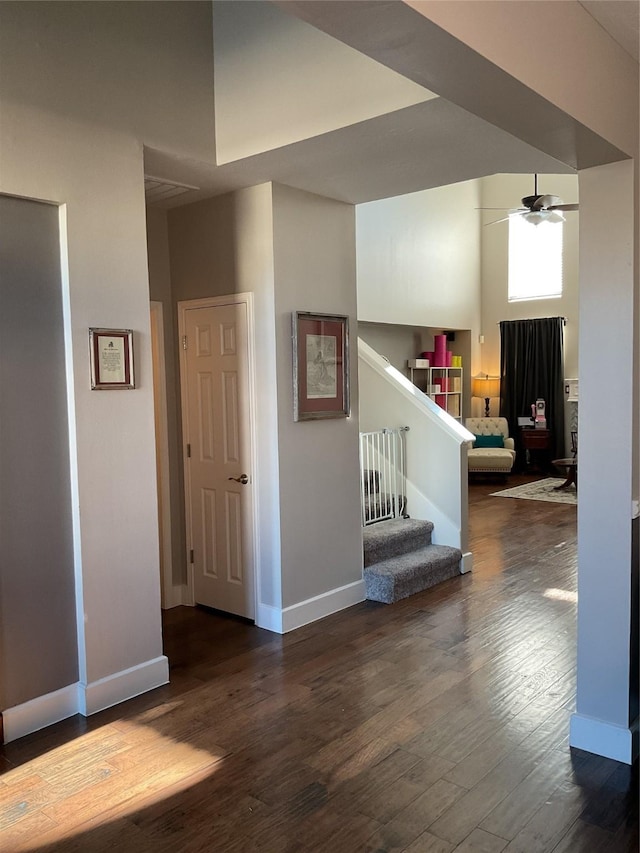 interior space with dark hardwood / wood-style floors and ceiling fan