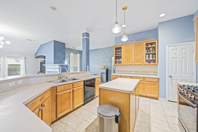 kitchen featuring light countertops, glass insert cabinets, a sink, gas range, and dishwasher