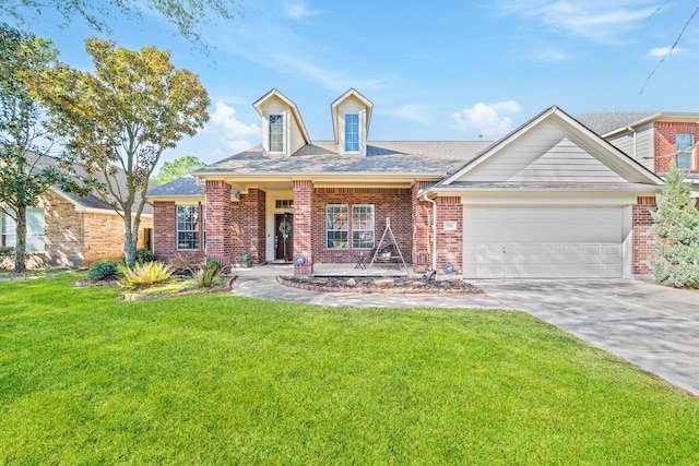 view of front of property featuring a garage, driveway, brick siding, and a front yard