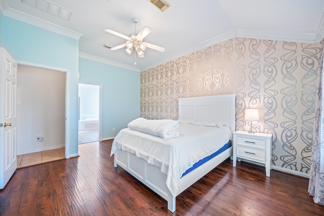 bedroom featuring ornamental molding, dark wood-style flooring, visible vents, and wallpapered walls