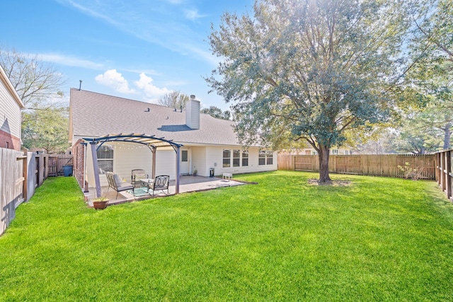 rear view of house featuring a fenced backyard, a lawn, a pergola, a chimney, and a patio area