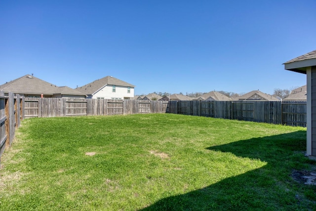 view of yard featuring a fenced backyard