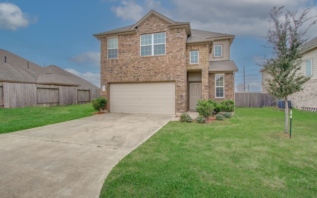 view of front of home with a garage and a front lawn