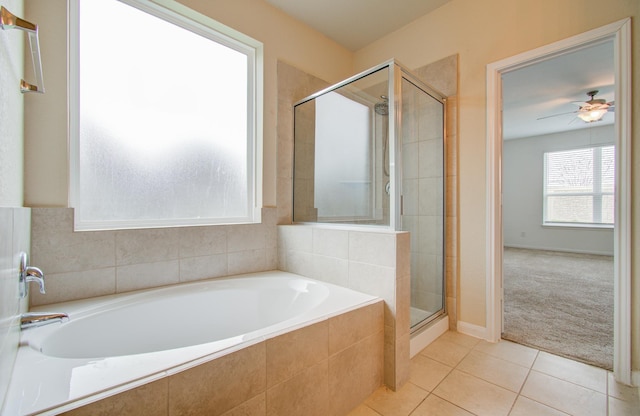 bathroom featuring tile patterned floors, shower with separate bathtub, and ceiling fan