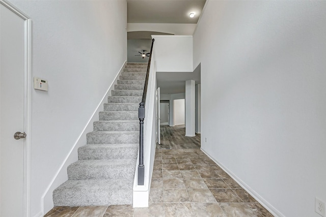 stairway with ceiling fan