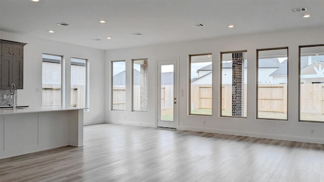 interior space with sink and light hardwood / wood-style floors