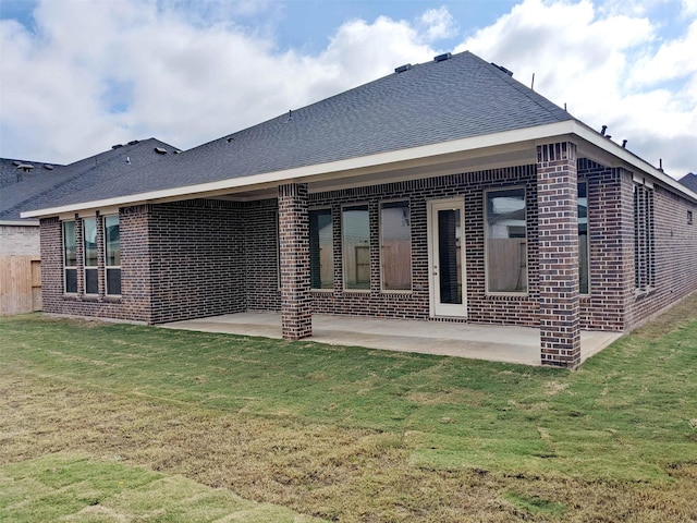 back of house with a yard and a patio area