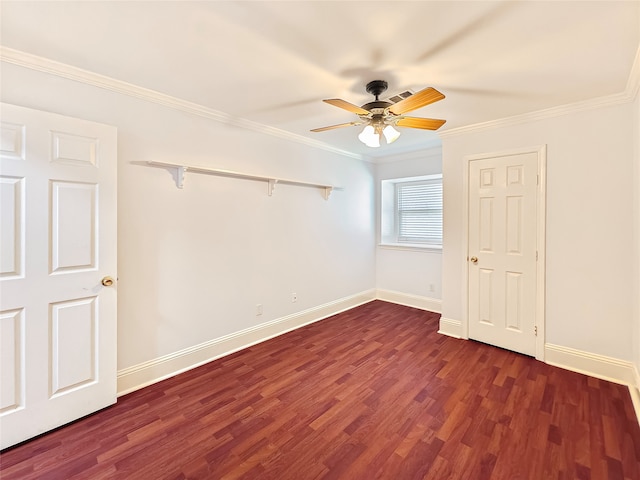 spare room with ornamental molding, dark hardwood / wood-style floors, and ceiling fan