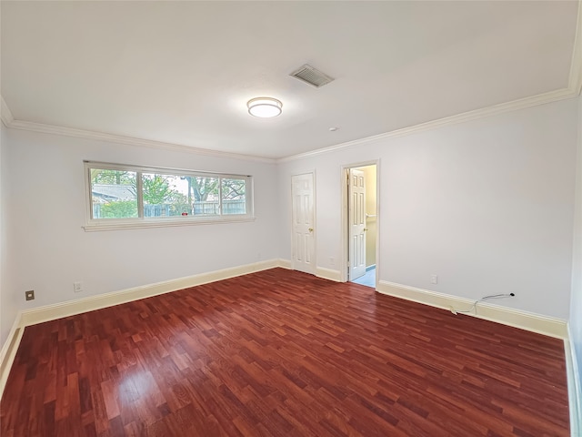 spare room with ornamental molding and hardwood / wood-style floors