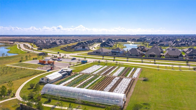 bird's eye view with a water view and a residential view