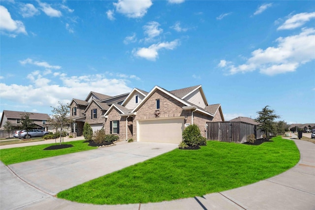 view of front facade featuring a front lawn, fence, a residential view, concrete driveway, and a garage