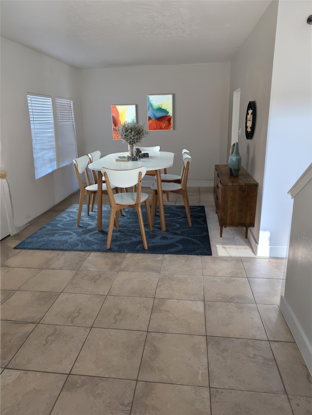 tiled dining area with baseboards