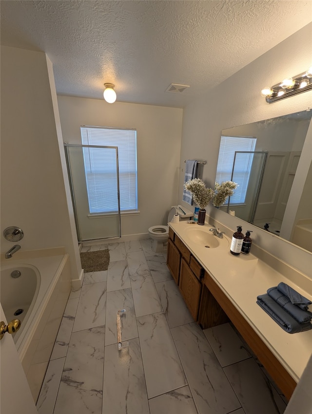 9767 Farrell Dr, Houston, TX 77070 - bathroom with a stall shower, marble look tiles, a bath, vanity, and a textured ceiling