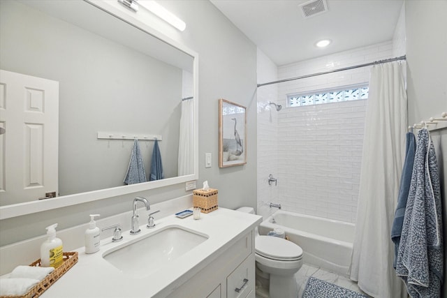 bathroom featuring toilet, shower / bath combo, visible vents, and vanity