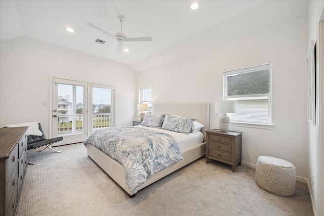 bedroom featuring light colored carpet, lofted ceiling, access to outside, and visible vents