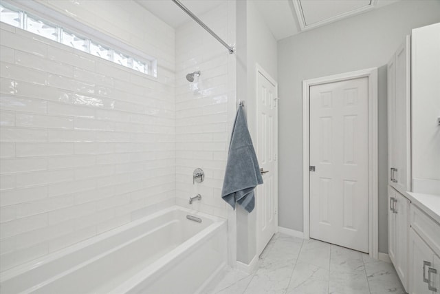 bathroom featuring shower / washtub combination, marble finish floor, vanity, and baseboards