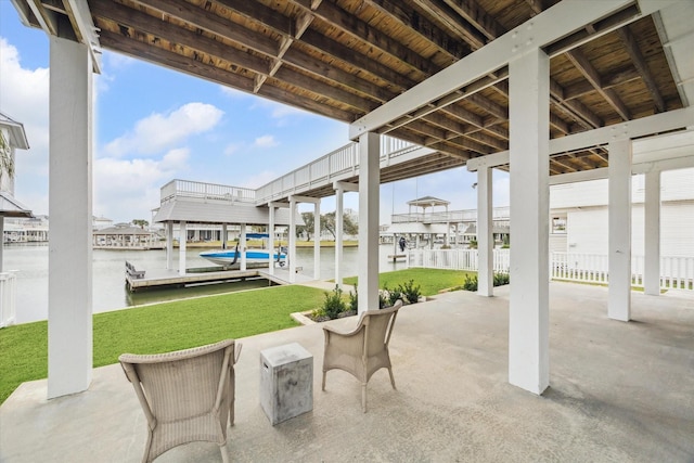 view of patio featuring a boat dock, a water view, and boat lift