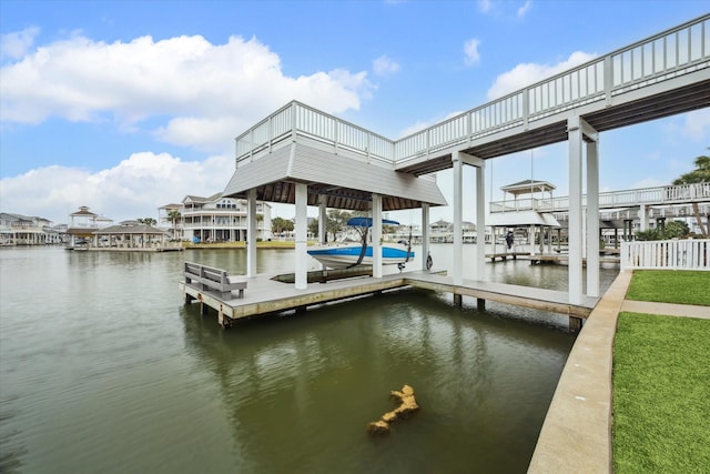 view of dock with a water view and boat lift