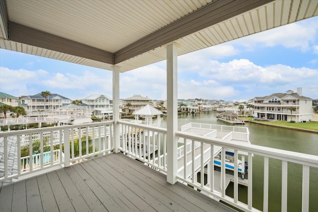 deck featuring a water view and a residential view