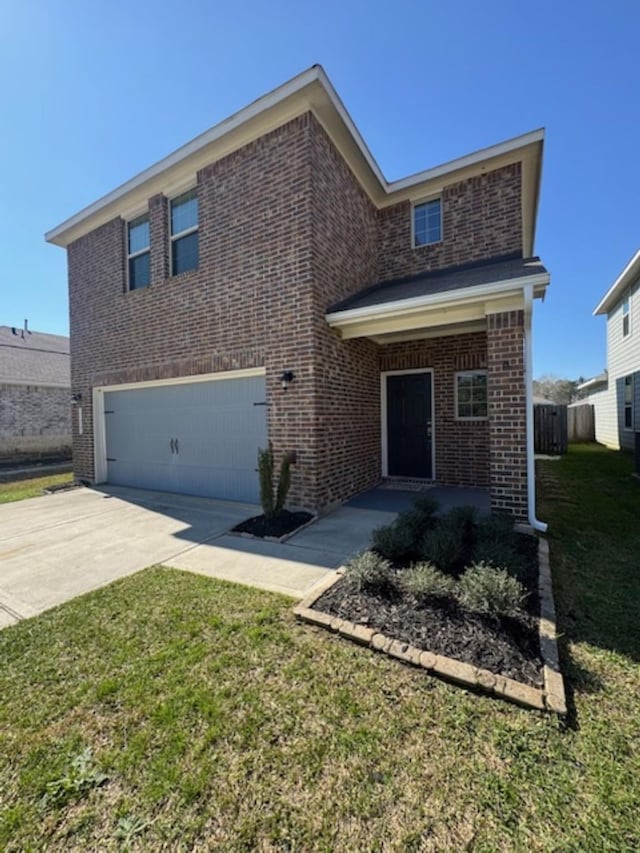 view of front facade with a garage and a front lawn