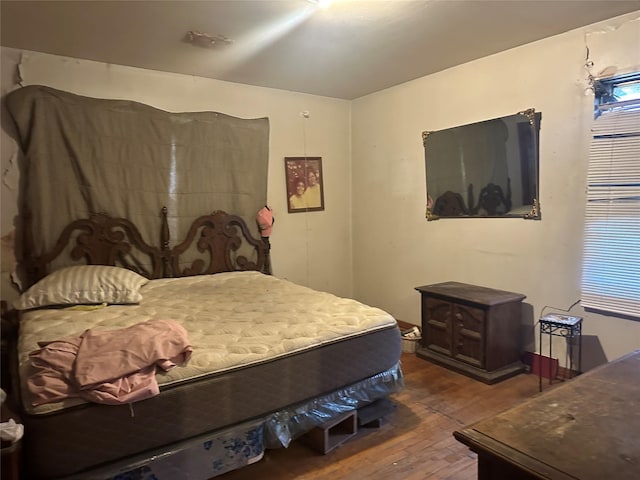 bedroom featuring hardwood / wood-style flooring