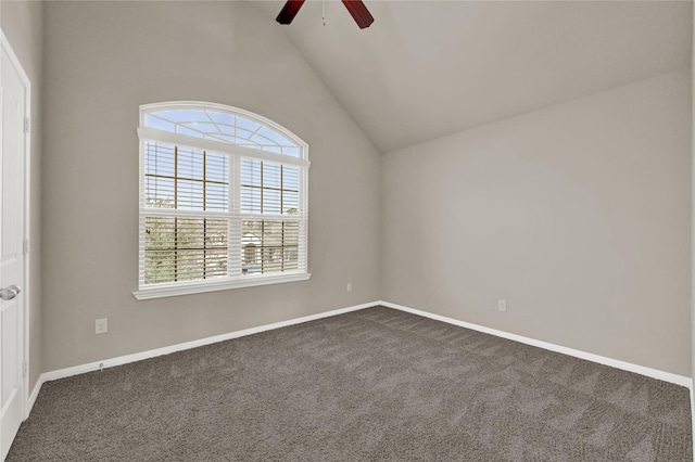 carpeted empty room with vaulted ceiling and ceiling fan