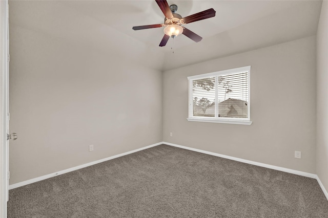 empty room featuring dark carpet and ceiling fan