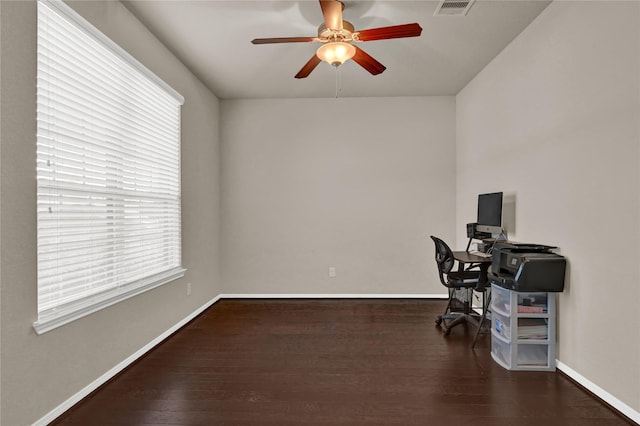 office space featuring ceiling fan and dark hardwood / wood-style floors