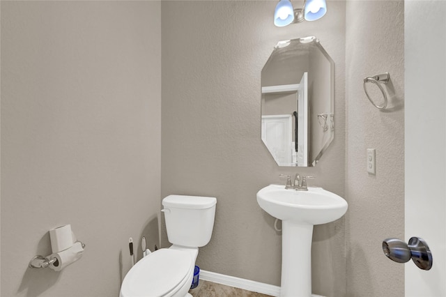 bathroom with sink and toilet