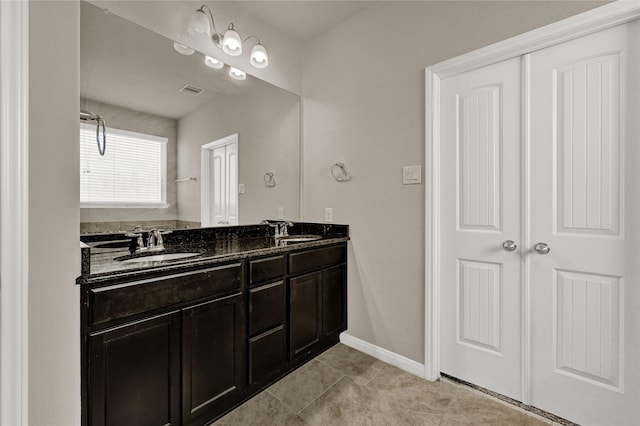 bathroom with vanity and tile patterned floors