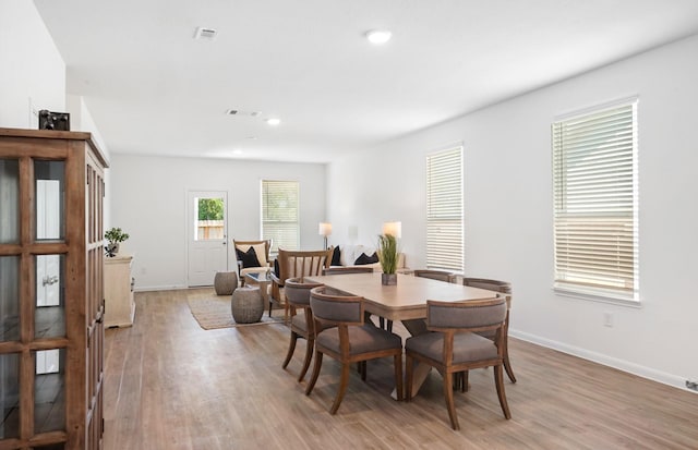 dining area with light wood-type flooring