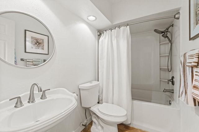 full bathroom with shower / bathtub combination with curtain, sink, and toilet