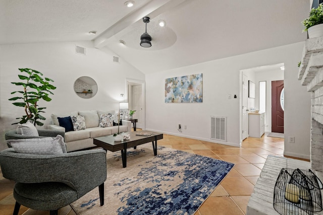 tiled living room with ceiling fan and vaulted ceiling with beams