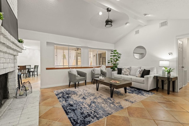 living room featuring beam ceiling, ceiling fan, high vaulted ceiling, and a brick fireplace