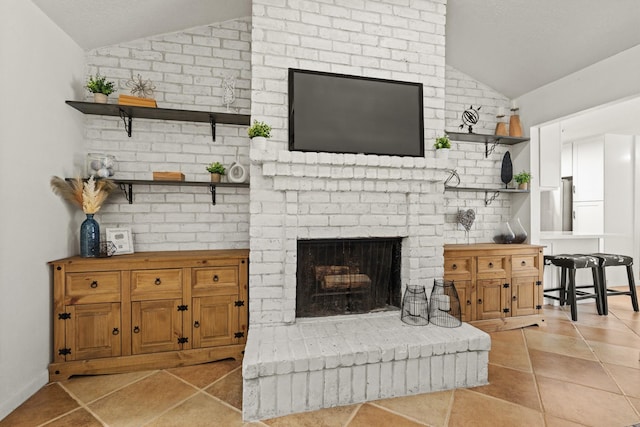 tiled living room featuring a fireplace and lofted ceiling