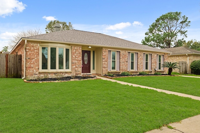 ranch-style home featuring a front yard